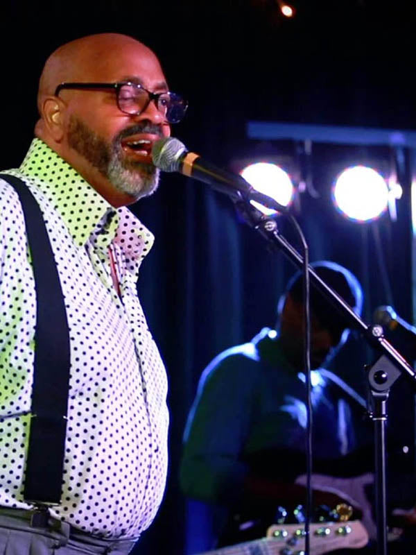 Derek Bordeaux performing on stage